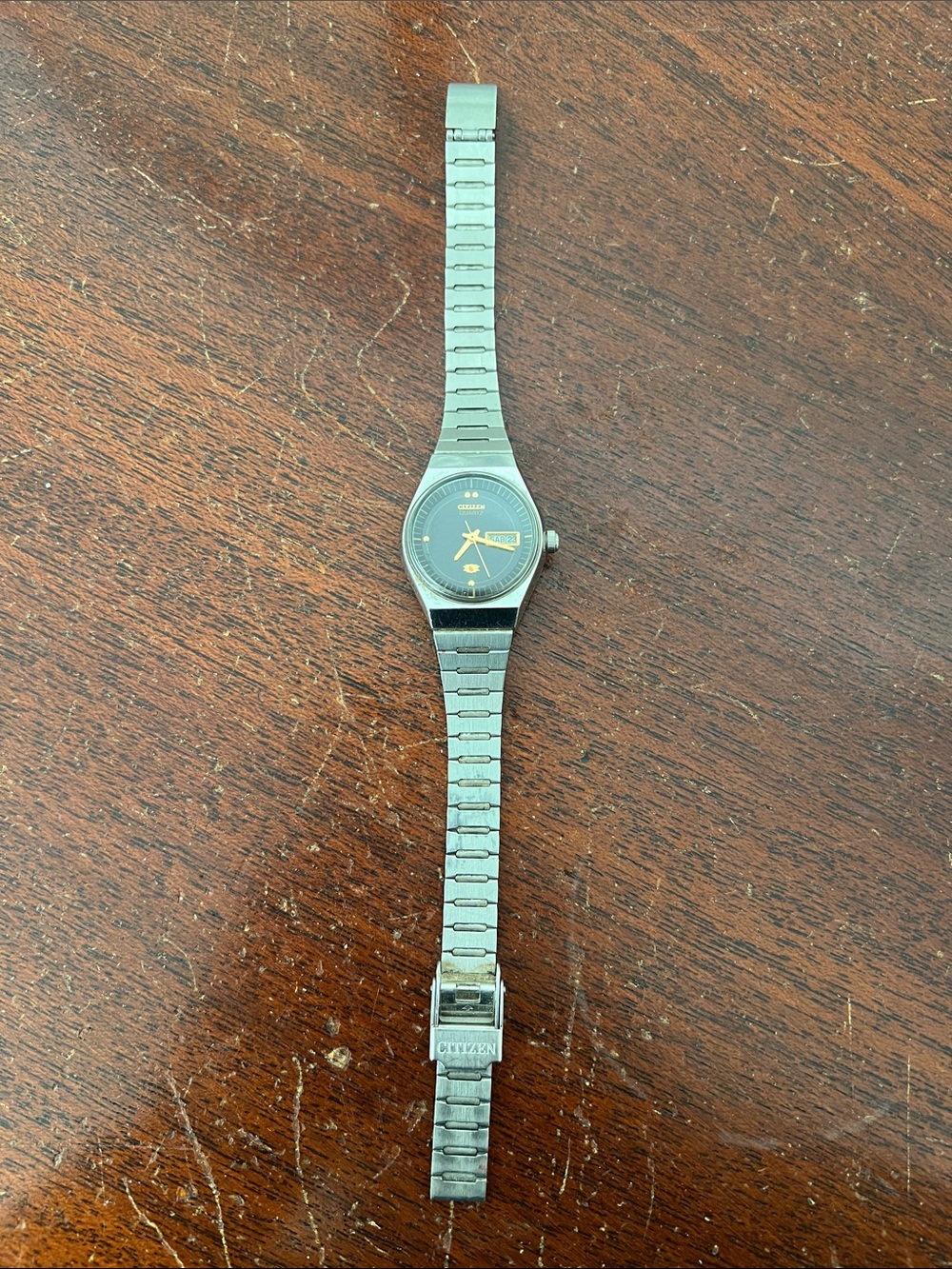 Citizen Silver Metal Bracelet Watch with Black Dial and Gold Accents